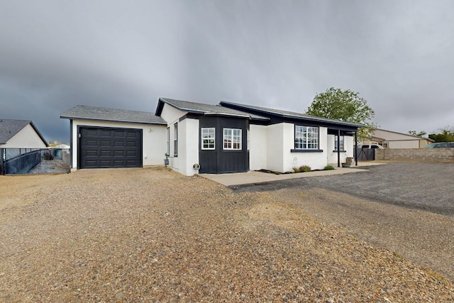 404 Pecos Loop SE, Rio Rancho, NM 87124 - single story home with an attached garage, driveway, and stucco siding