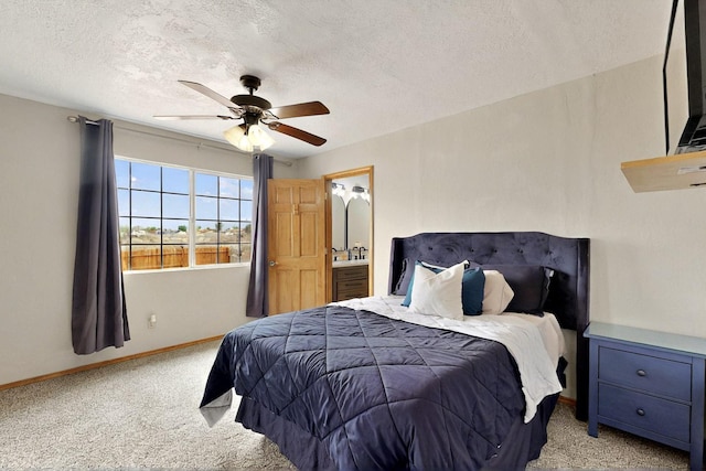 404 Pecos Loop SE, Rio Rancho, NM 87124 - bedroom featuring carpet, a textured ceiling, baseboards, ceiling fan, and connected bathroom