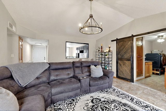 404 Pecos Loop SE, Rio Rancho, NM 87124 - living area featuring a barn door, lofted ceiling, and a chandelier