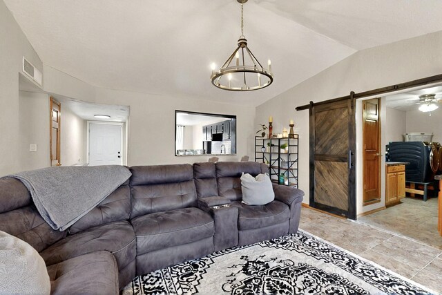 404 Pecos Loop SE, Rio Rancho, NM 87124 - living room with a barn door, lofted ceiling, and a chandelier