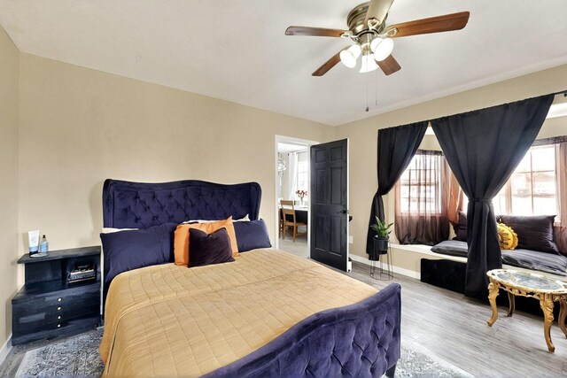 404 Pecos Loop SE, Rio Rancho, NM 87124 - bedroom featuring wood finished floors, baseboards, and ceiling fan