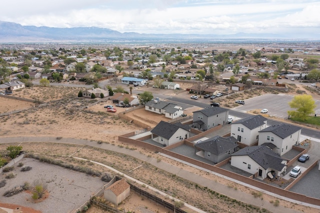 404 Pecos Loop SE, Rio Rancho, NM 87124 - aerial perspective of suburban area with a mountainous background