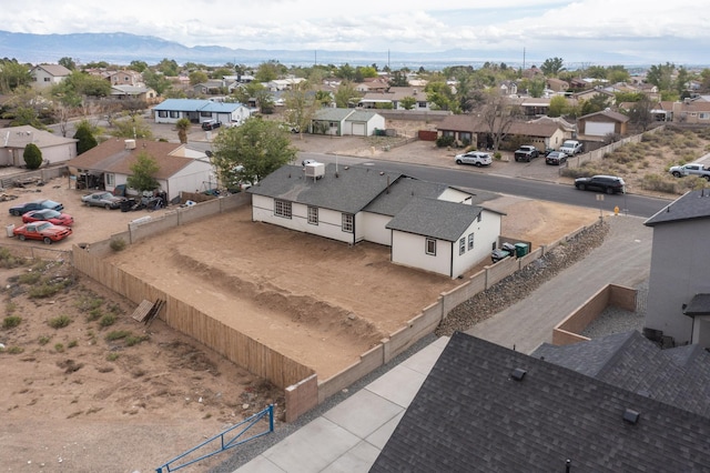 404 Pecos Loop SE, Rio Rancho, NM 87124 - aerial perspective of suburban area featuring a mountainous background