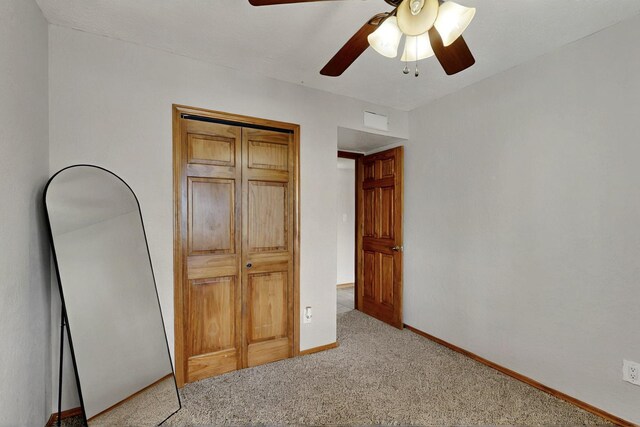 404 Pecos Loop SE, Rio Rancho, NM 87124 - unfurnished bedroom with carpet flooring, baseboards, and ceiling fan