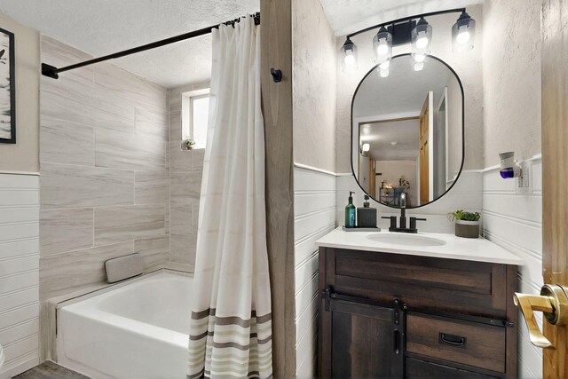 404 Pecos Loop SE, Rio Rancho, NM 87124 - bathroom with vanity, a textured ceiling, and shower / bath combination with curtain