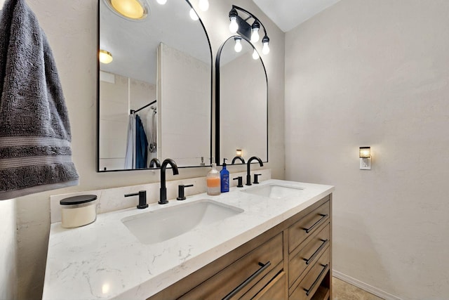 404 Pecos Loop SE, Rio Rancho, NM 87124 - bathroom featuring double vanity and a shower with curtain