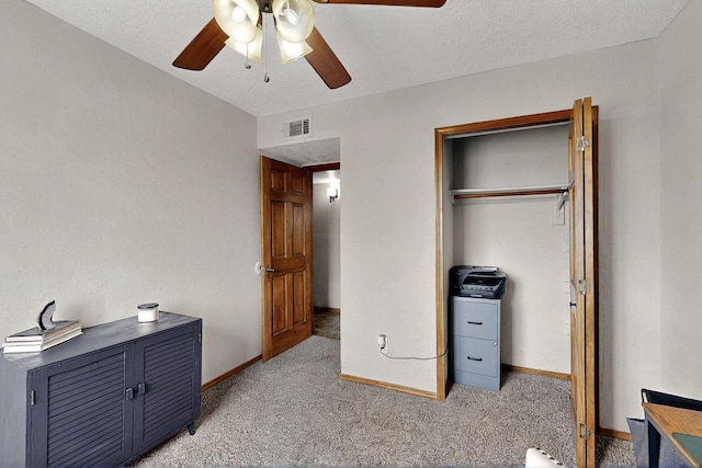 404 Pecos Loop SE, Rio Rancho, NM 87124 - unfurnished bedroom featuring light colored carpet, a closet, ceiling fan, and baseboards