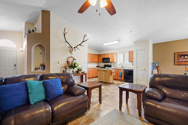 3772 Havasu Falls St NE, Rio Rancho, NM 87144 - living area featuring a textured ceiling, lofted ceiling, and a ceiling fan