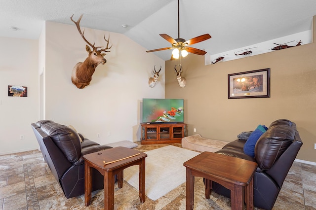 3772 Havasu Falls St NE, Rio Rancho, NM 87144 - living room with ceiling fan, lofted ceiling, light stone finish flooring, and baseboards