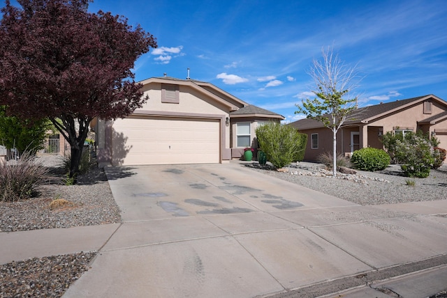 3772 Havasu Falls St NE, Rio Rancho, NM 87144 - ranch-style house with stucco siding, concrete driveway, and a garage