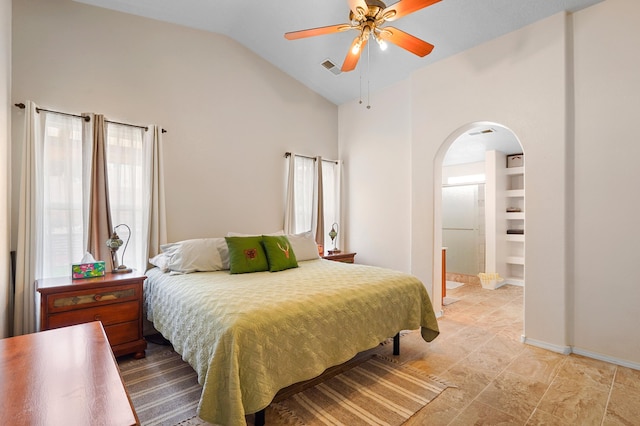 3772 Havasu Falls St NE, Rio Rancho, NM 87144 - bedroom featuring arched walkways, vaulted ceiling, connected bathroom, and a ceiling fan