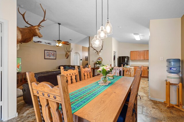 3772 Havasu Falls St NE, Rio Rancho, NM 87144 - dining area with a ceiling fan, lofted ceiling, and light stone finish flooring