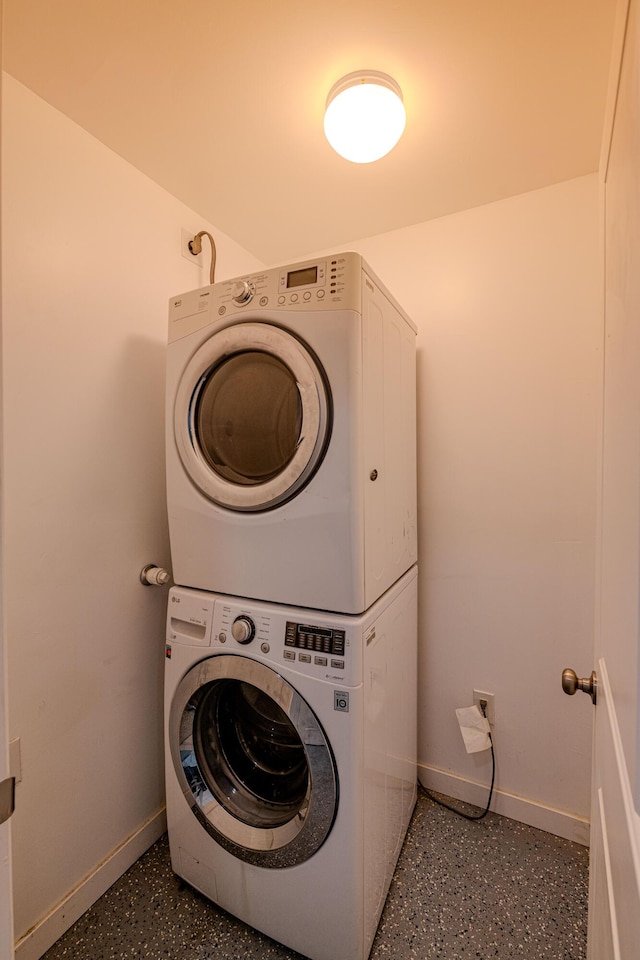 15161/2 Gallegos Rd SW, Albuquerque, NM 87105 - laundry room featuring stacked washer and clothes dryer and baseboards
