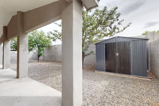 8912 Silverado Ave SW, Albuquerque, NM 87121 - view of patio with a storage shed, a fenced backyard, and an outdoor structure