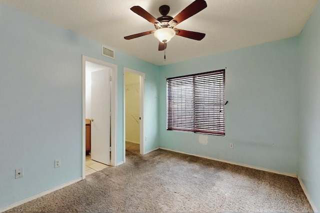 8912 Silverado Ave SW, Albuquerque, NM 87121 - unfurnished bedroom with carpet flooring, a walk in closet, a closet, and baseboards