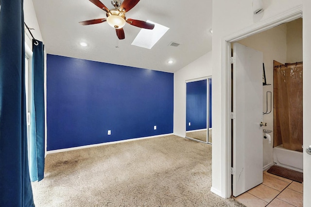 8912 Silverado Ave SW, Albuquerque, NM 87121 - unfurnished bedroom with a skylight, lofted ceiling, carpet flooring, baseboards, and a ceiling fan