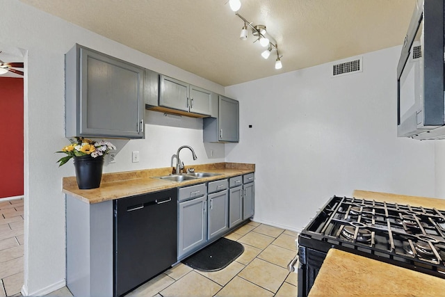 8912 Silverado Ave SW, Albuquerque, NM 87121 - kitchen featuring dishwasher, gas range, a sink, gray cabinetry, and light tile patterned flooring