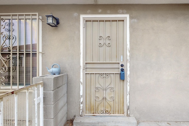 8912 Silverado Ave SW, Albuquerque, NM 87121 - view of exterior entry featuring stucco siding