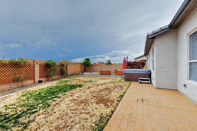 7241 Aldan Dr NE, Rio Rancho, NM 87144 - fenced backyard with a hot tub and a patio area