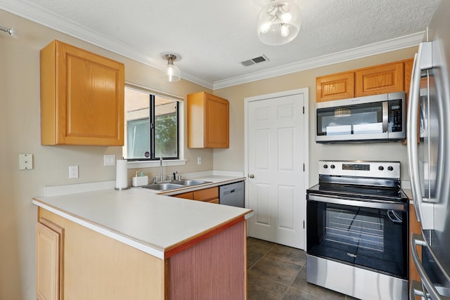 kitchen with appliances with stainless steel finishes, a sink, ornamental molding, a peninsula, and light countertops