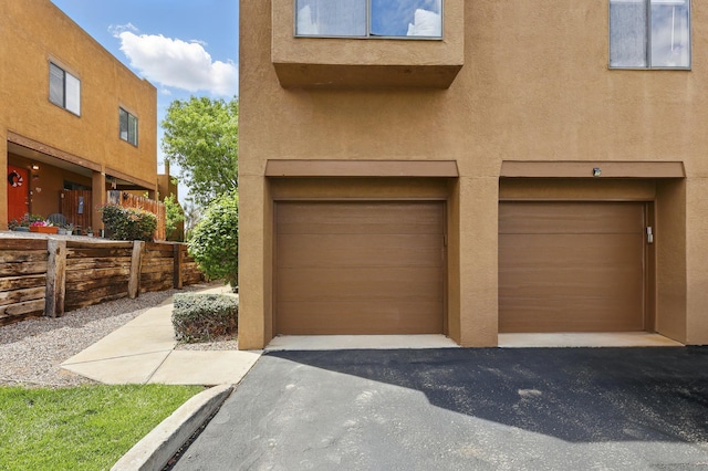 garage featuring driveway