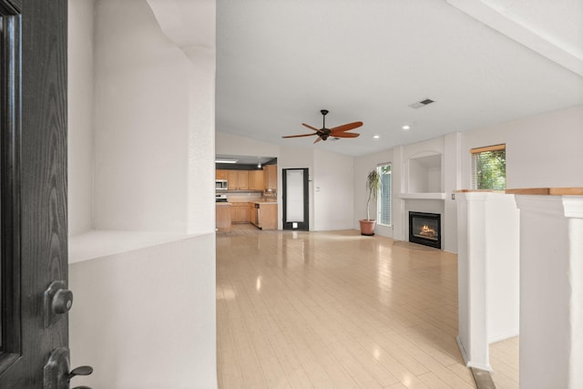 4700 Crestridge Ave NW, Albuquerque, NM 87114 - unfurnished living room with a glass covered fireplace, a ceiling fan, recessed lighting, and light wood finished floors
