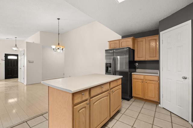 4700 Crestridge Ave NW, Albuquerque, NM 87114 - kitchen featuring stainless steel refrigerator with ice dispenser, light tile patterned floors, a center island, and decorative light fixtures