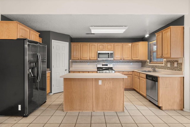 4700 Crestridge Ave NW, Albuquerque, NM 87114 - kitchen with stainless steel appliances, a sink, light countertops, and decorative backsplash