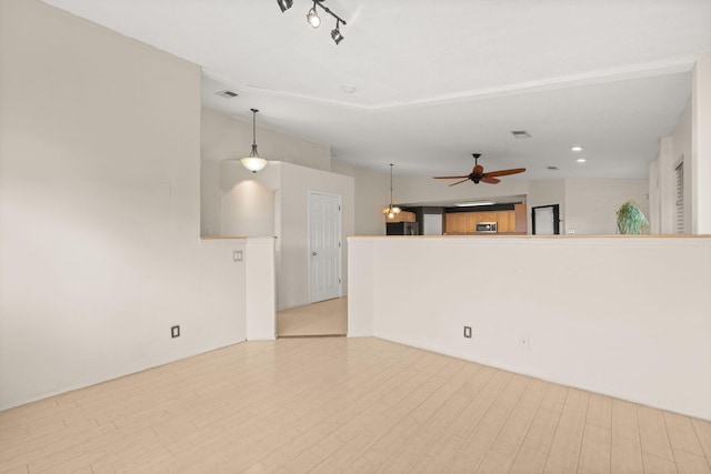 4700 Crestridge Ave NW, Albuquerque, NM 87114 - unfurnished living room with a ceiling fan and wood finished floors