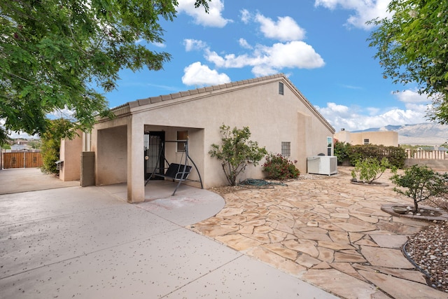 4700 Crestridge Ave NW, Albuquerque, NM 87114 - back of house featuring stucco siding and a patio