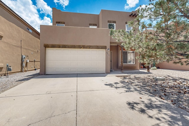 2512 Sarita Ave NW, Albuquerque, NM 87104 - adobe home featuring stucco siding and concrete driveway
