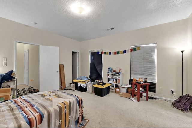 2512 Sarita Ave NW, Albuquerque, NM 87104 - bedroom with carpet floors and a textured ceiling