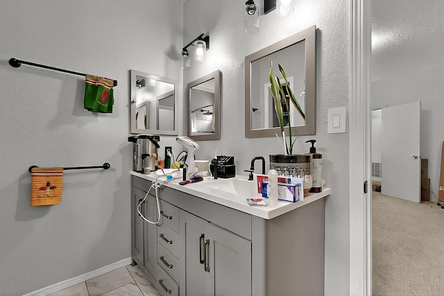 2512 Sarita Ave NW, Albuquerque, NM 87104 - bathroom featuring vanity and baseboards