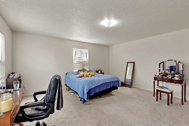 2512 Sarita Ave NW, Albuquerque, NM 87104 - bedroom with carpet flooring, a textured ceiling, and a desk