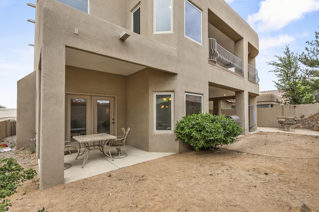4613 Croyden Ave NW, Albuquerque, NM 87114 - back of house featuring stucco siding and a patio area
