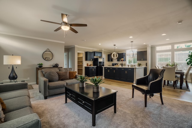 1899 Vargas Rd SE, Rio Rancho, NM 87124 - living area featuring ornamental molding, ceiling fan, recessed lighting, and light wood-style floors