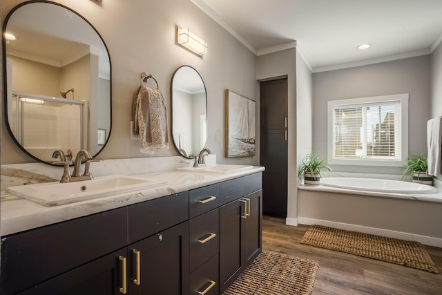 1899 Vargas Rd SE, Rio Rancho, NM 87124 - bathroom featuring crown molding, wood finished floors, a shower stall, double vanity, and a garden tub