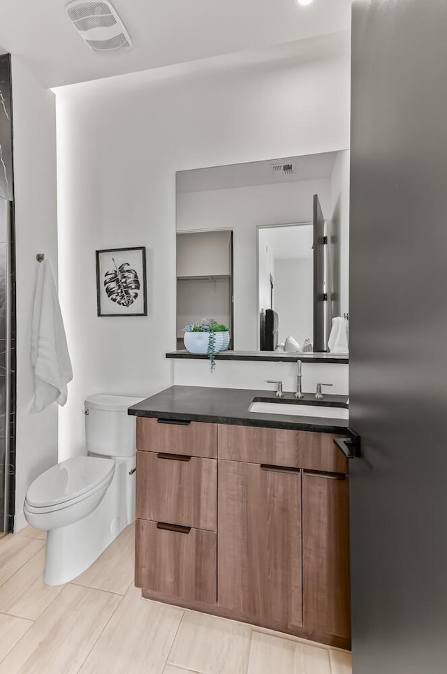 6511 Vista Del Prado, Albuquerque, NM 87120 - bathroom with toilet and vanity