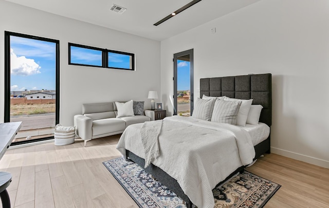 6511 Vista Del Prado, Albuquerque, NM 87120 - bedroom with light wood-style floors and baseboards