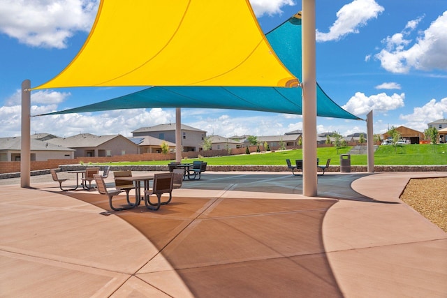 view of community with a residential view and a yard