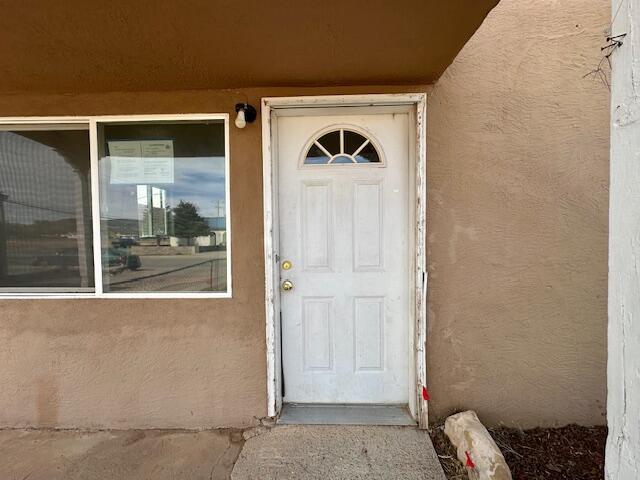 1205 Del Norte Blvd, Grants, NM 87020 - entrance to property with stucco siding