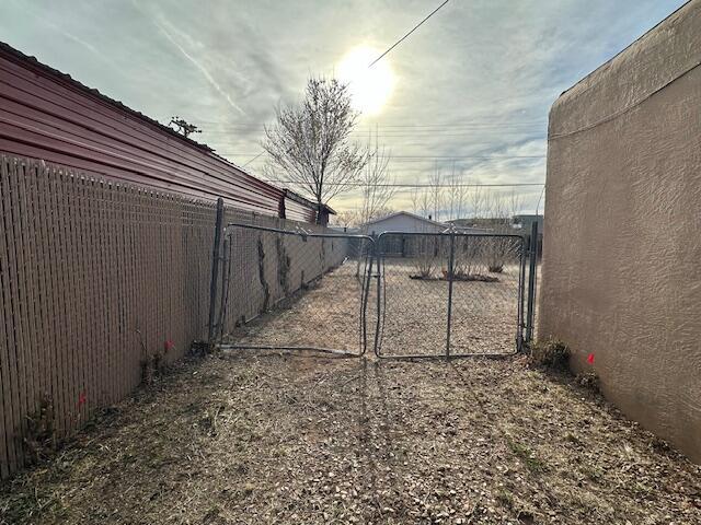 1205 Del Norte Blvd, Grants, NM 87020 - view of yard with a gate and fence