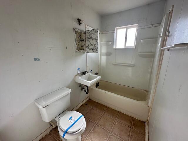 1205 Del Norte Blvd, Grants, NM 87020 - full bath with toilet, a sink, and tile patterned floors