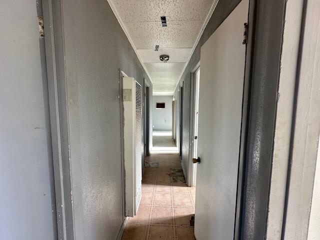 1205 Del Norte Blvd, Grants, NM 87020 - hallway featuring a heating unit and tile patterned floors