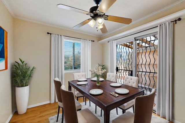 5721 Miller Rd NE, Rio Rancho, NM 87144 - dining space featuring ceiling fan, light wood finished floors, baseboards, and crown molding