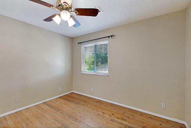 5721 Miller Rd NE, Rio Rancho, NM 87144 - spare room with hardwood / wood-style flooring, baseboards, and a ceiling fan