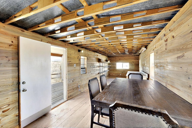 5721 Miller Rd NE, Rio Rancho, NM 87144 - dining space featuring wood walls, wood-type flooring, and cooling unit