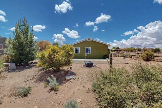 5721 Miller Rd NE, Rio Rancho, NM 87144 - back of house featuring fence and stucco siding