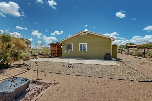5721 Miller Rd NE, Rio Rancho, NM 87144 - back of property featuring stucco siding and a patio area