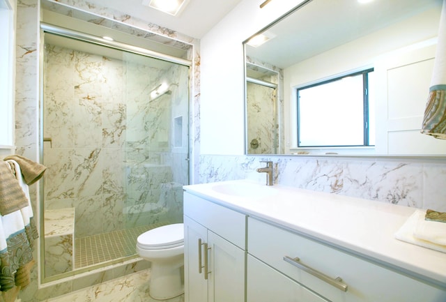 445 Rim Rd, Los Alamos, NM 87544 - bathroom with toilet, a marble finish shower, vanity, marble finish floors, and tile walls
